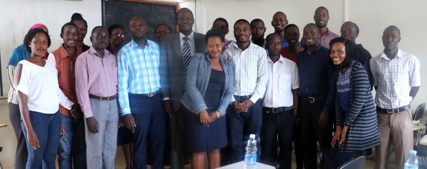 Prof Christopher Garimoi Orach (in striped tie) , the Deputy Dean of MakSPH and the Department Chair of CHBS, with staff and  the fresh Year I students at the orientation.