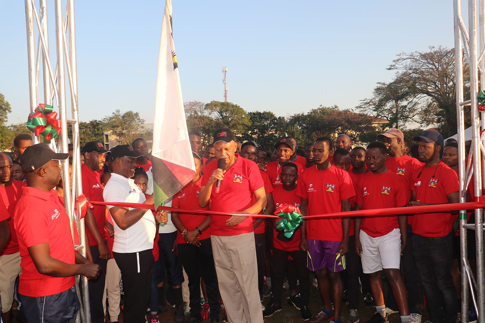 Prof Mondo flagging off the race at Makerere Freedom Square. At his right, holding the Makerere University flag is the Vice – Chancellor, Prof Barnabas Nawangwe (in white T-shirt)