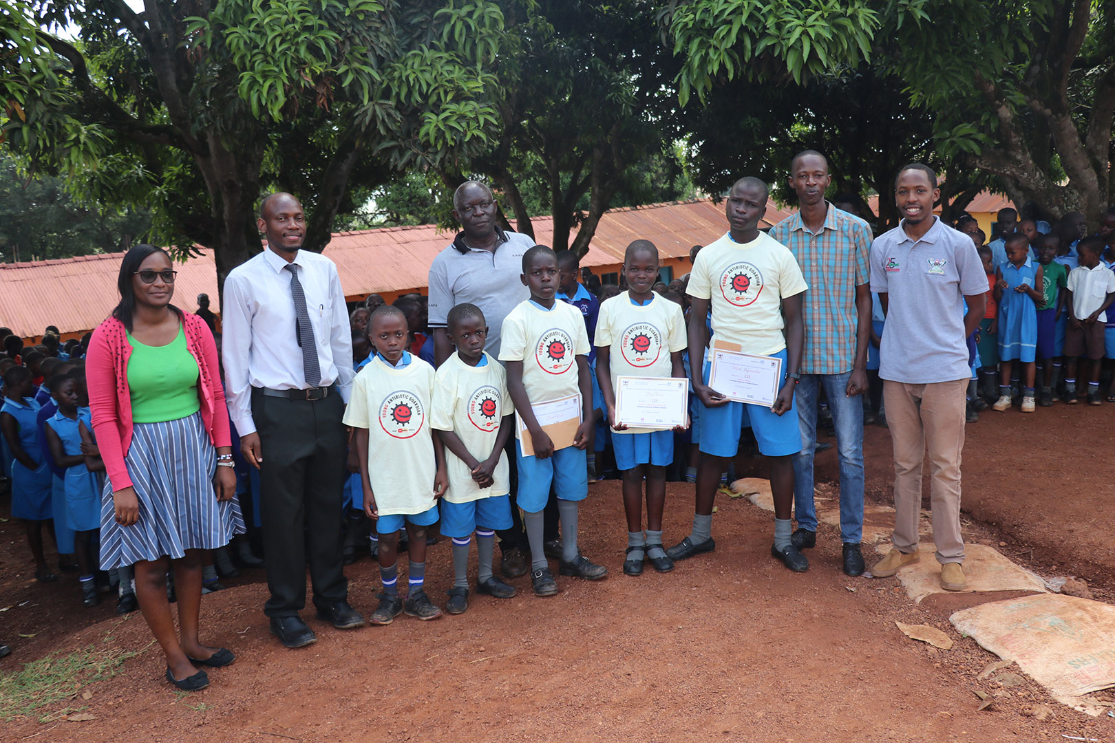 Part of the project team and the Headteacher (centre) with the winners at Kawotto Saviours Primary School.