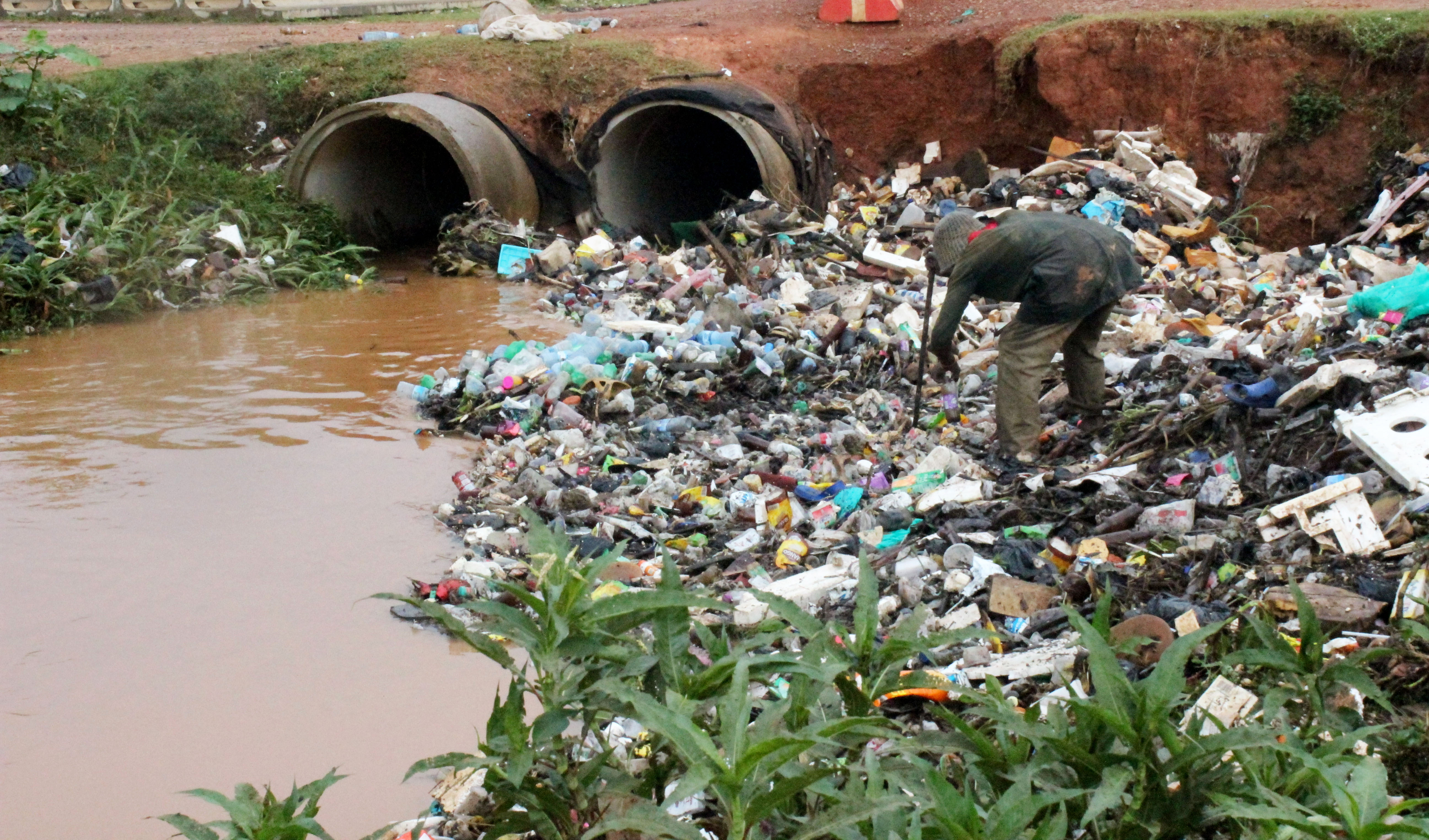 Water channel along Northern bypass dumped plastic bottles