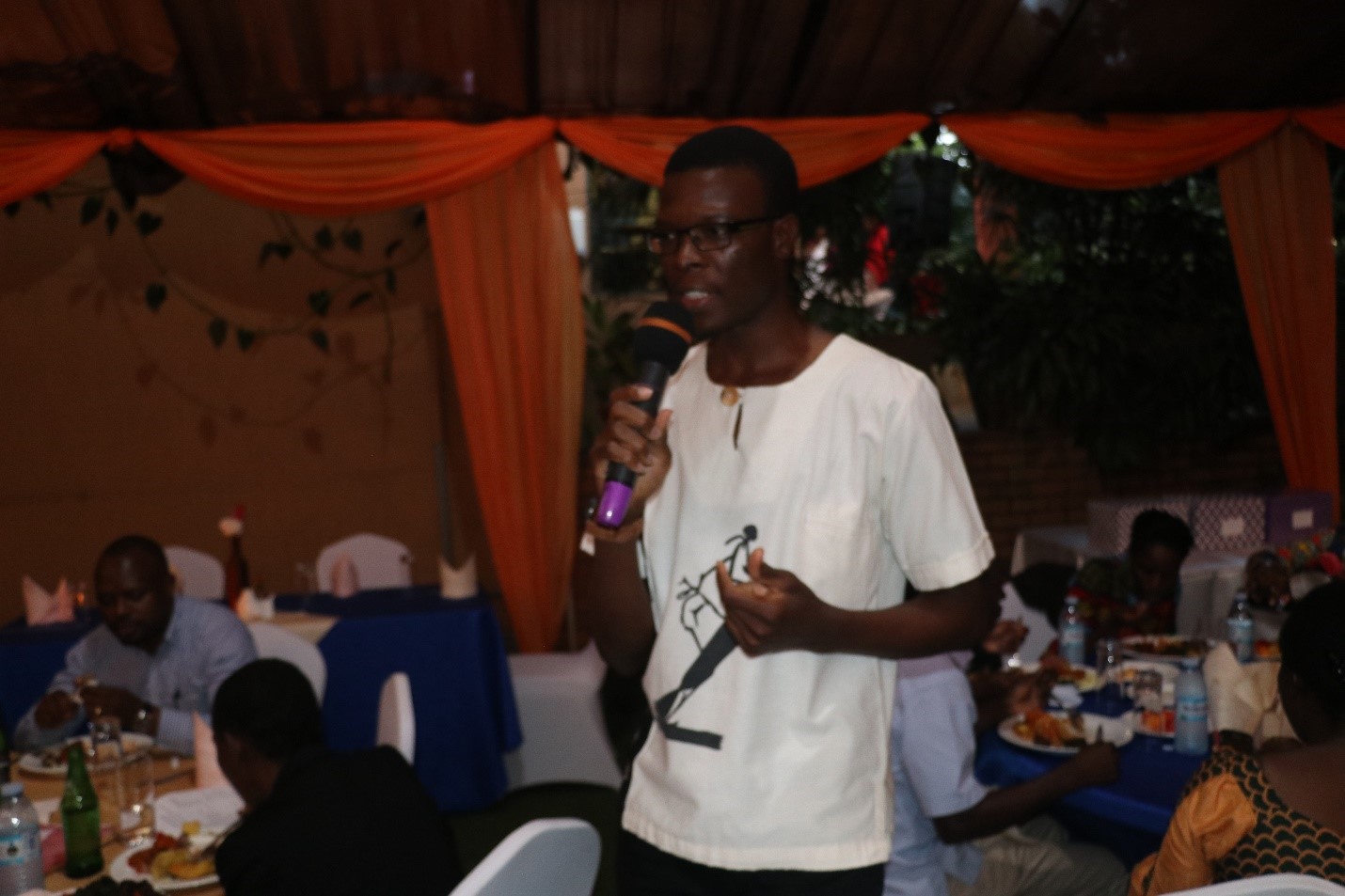Rawlance Ndejjo, the PhD Forum President welcoming guests at the dinner. The Forum offers support to students pursuing PhDs at MakSPH students and to staff who might be pursuing PhDs either at MakSPH or at other universities in the world.