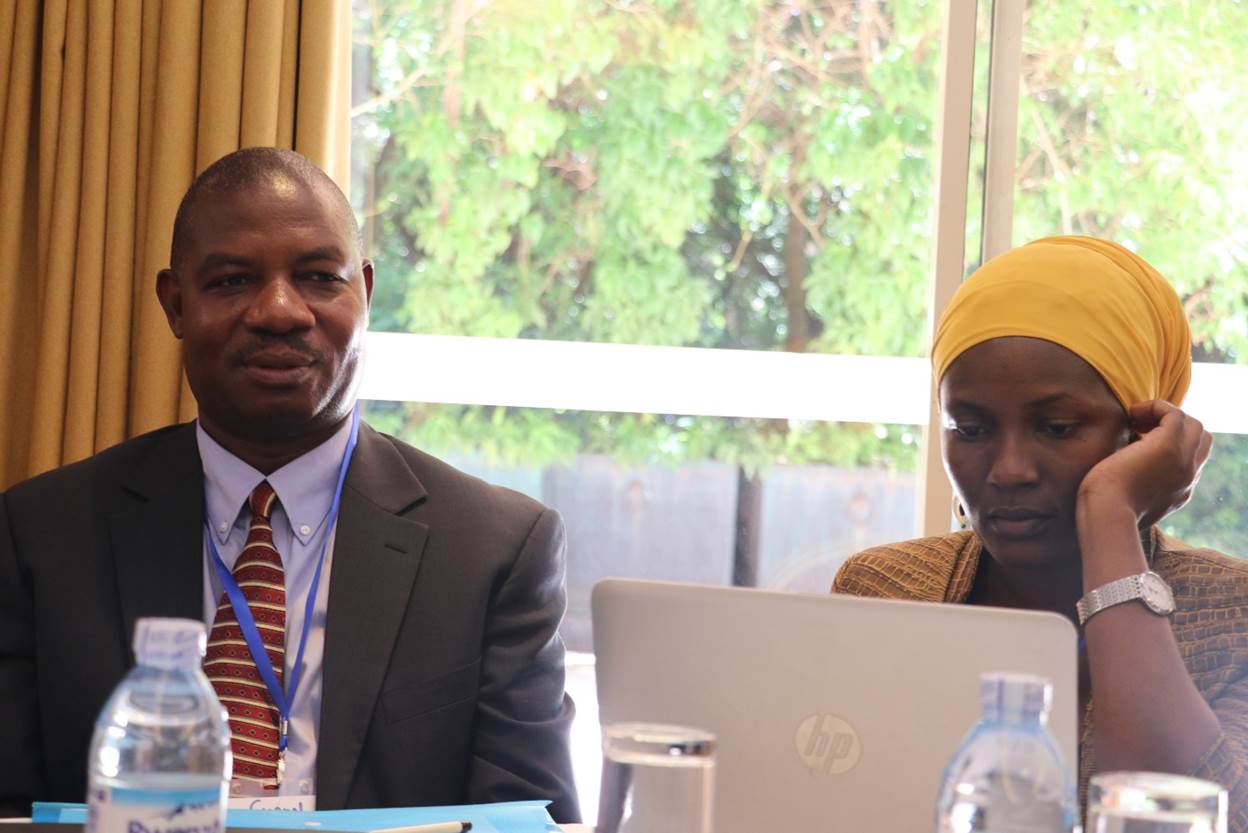 Dr. Simon Kasasa (L) one of the Principal Coordinators of the project, at the evaluation study dissemination meeting. Right is Dr. Susan Babirye, a Study Coordinator on this project.