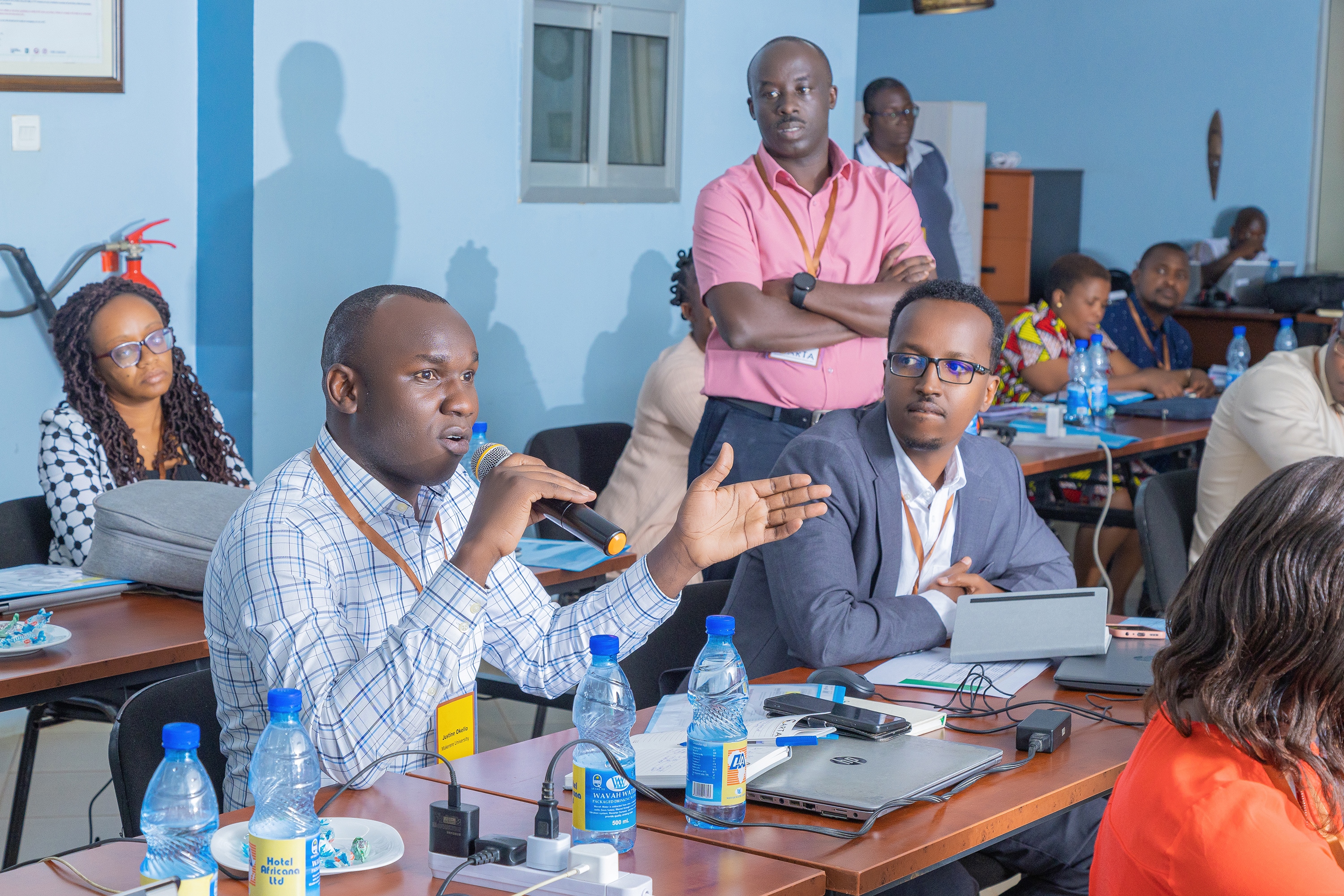 Gallad listening keenly to Uganda's Justine Okello, during JAS 1 training for the 11th Cohort in Kampala. 3rd March 2025.