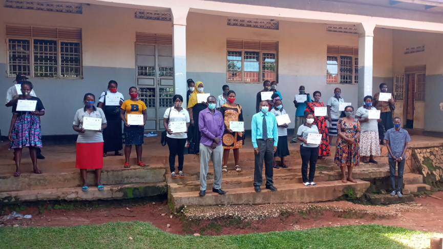 Village Health Team members display their certificates following the training in Kitende, Kajjansi Town Council. Mr. Adam Mbayi, In-charge Kajjansi Health Centre IV (purple shirt in first line) and Ms. Christine Wanyana (dress in first line) were among the facilitators of the training.