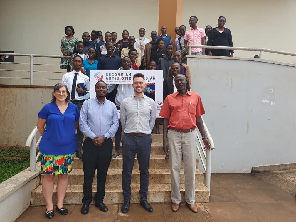 A group photo of the facilitators and staff (At the front from the left is Natasha Hamilton-Tanner, Dr. Herbert Bush Aguma, Aarash Ahmadi and Dr. Robert B.D Otto) with some of the students who attended the AMS seminar at School of Pharmacy, Makerere University. 