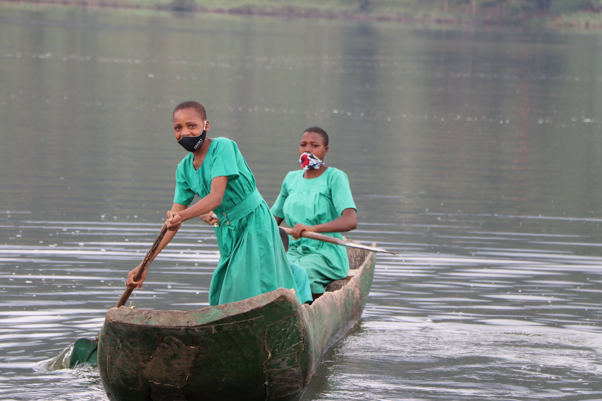 Children canoeing to school on Lake Bunyonyi in southwestern Uganda. Photo by Uganda Red Cross Society