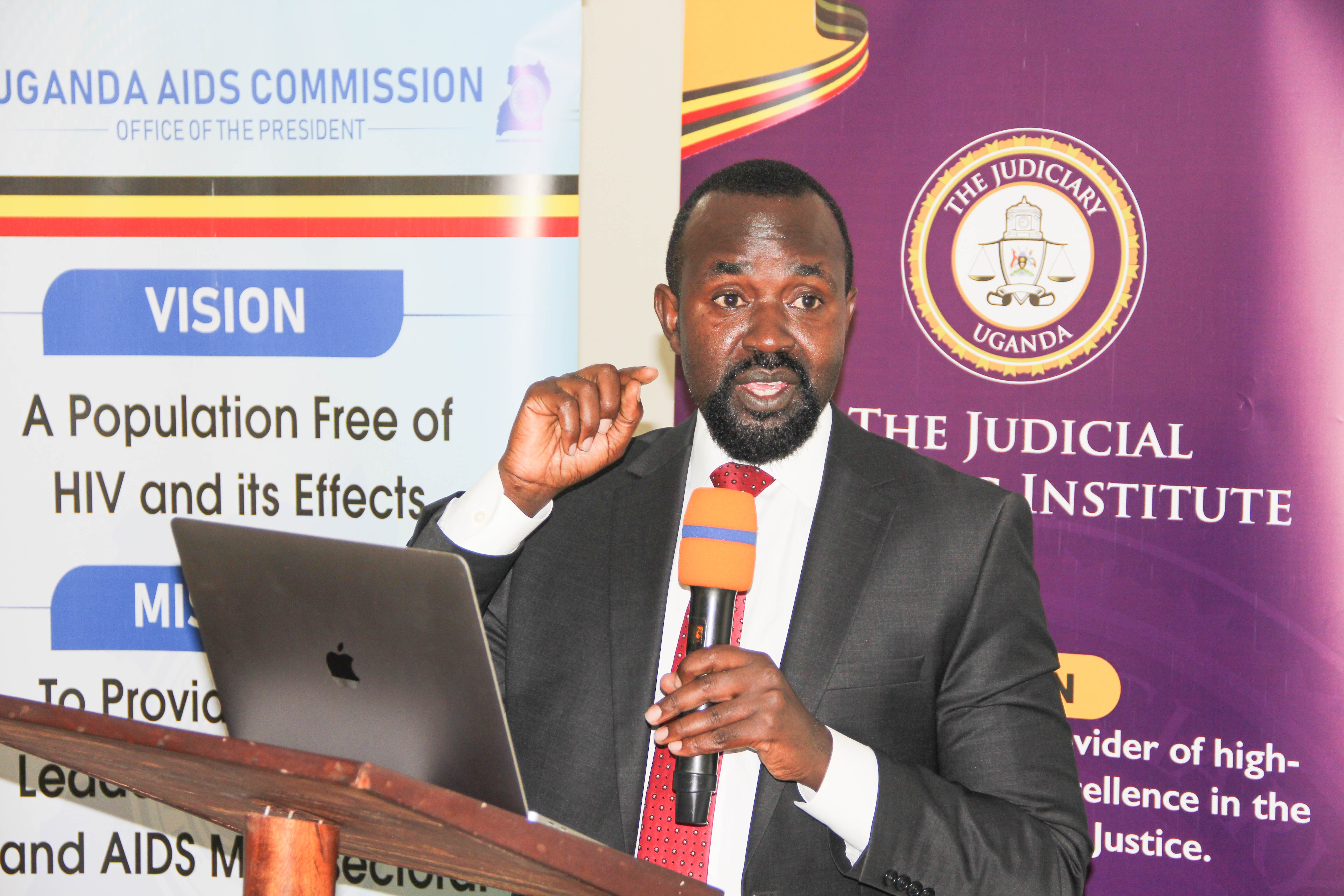 Justice Phillip Odoki, the Head Gulu Court Circuit, opening the ceremony during the Northern Uganda cluster judicial officers workshop on HIV and key populations in August 2024.