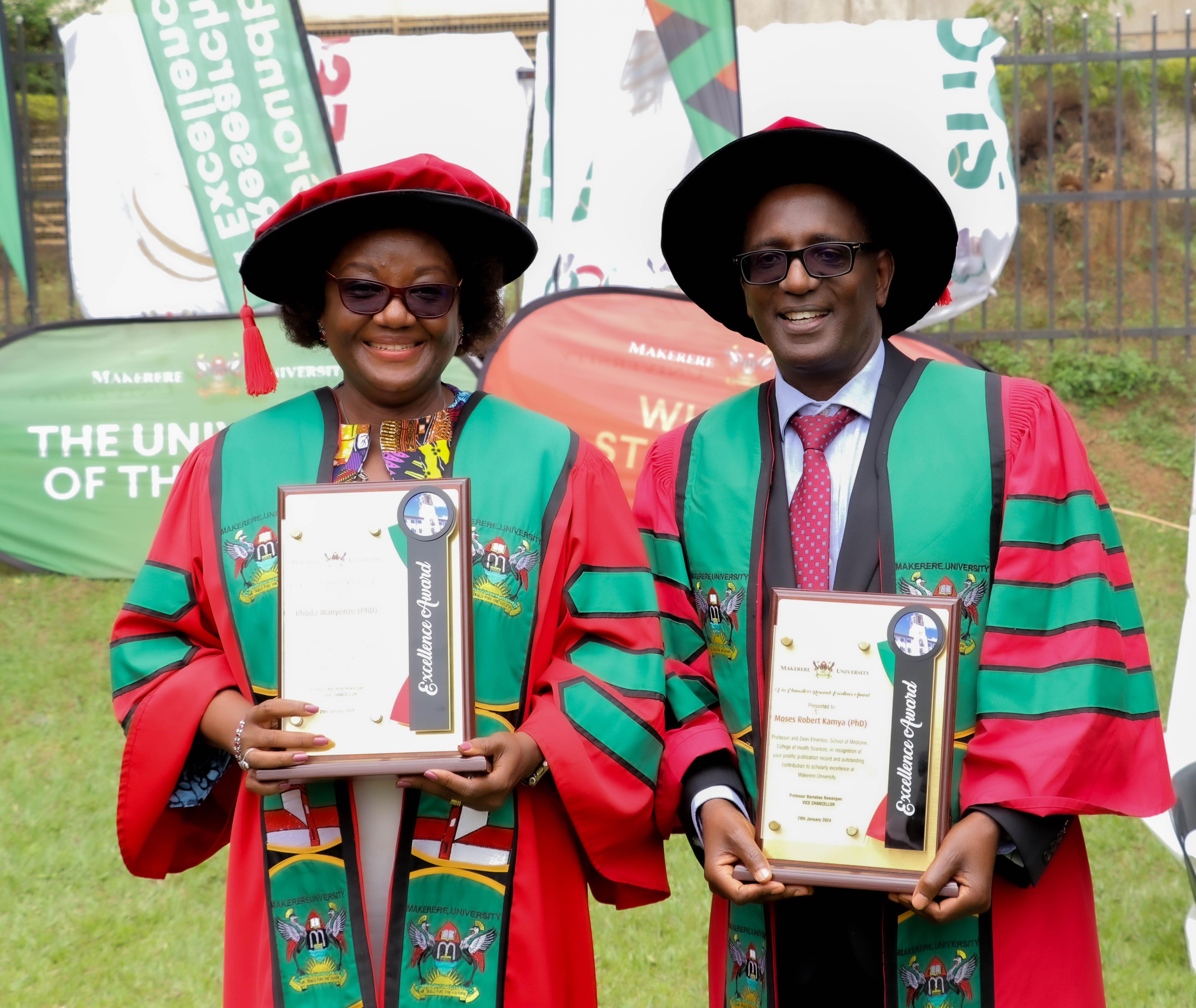 Professor Moses Robert Kamya and Professor Rhoda Wanyenze the Best Overall Male and Female Researchers at Makerere University showcase their plaques