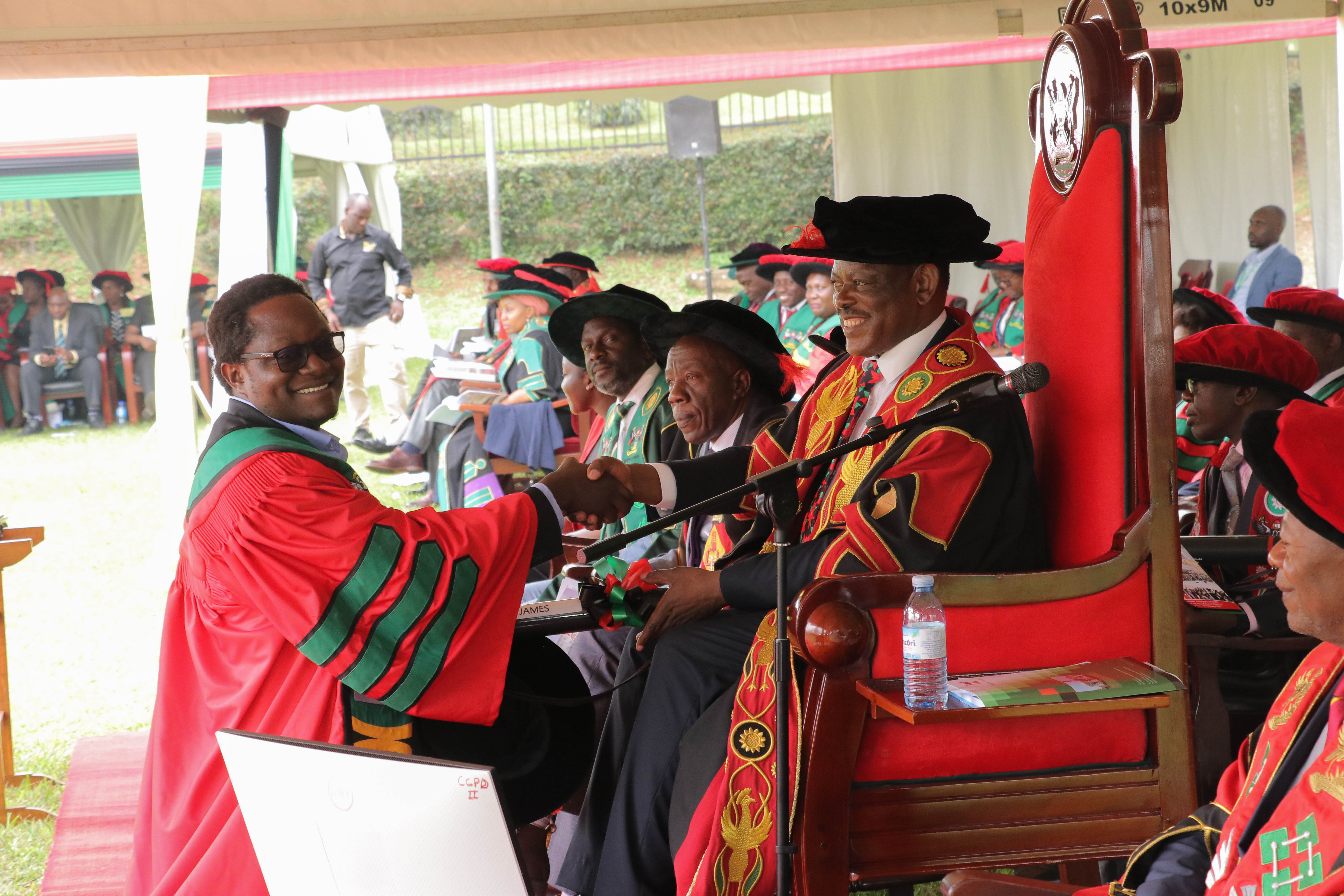 Dr. James Muleme receives his PhD from the Chancellor, Professor Barnabas Nawangwe