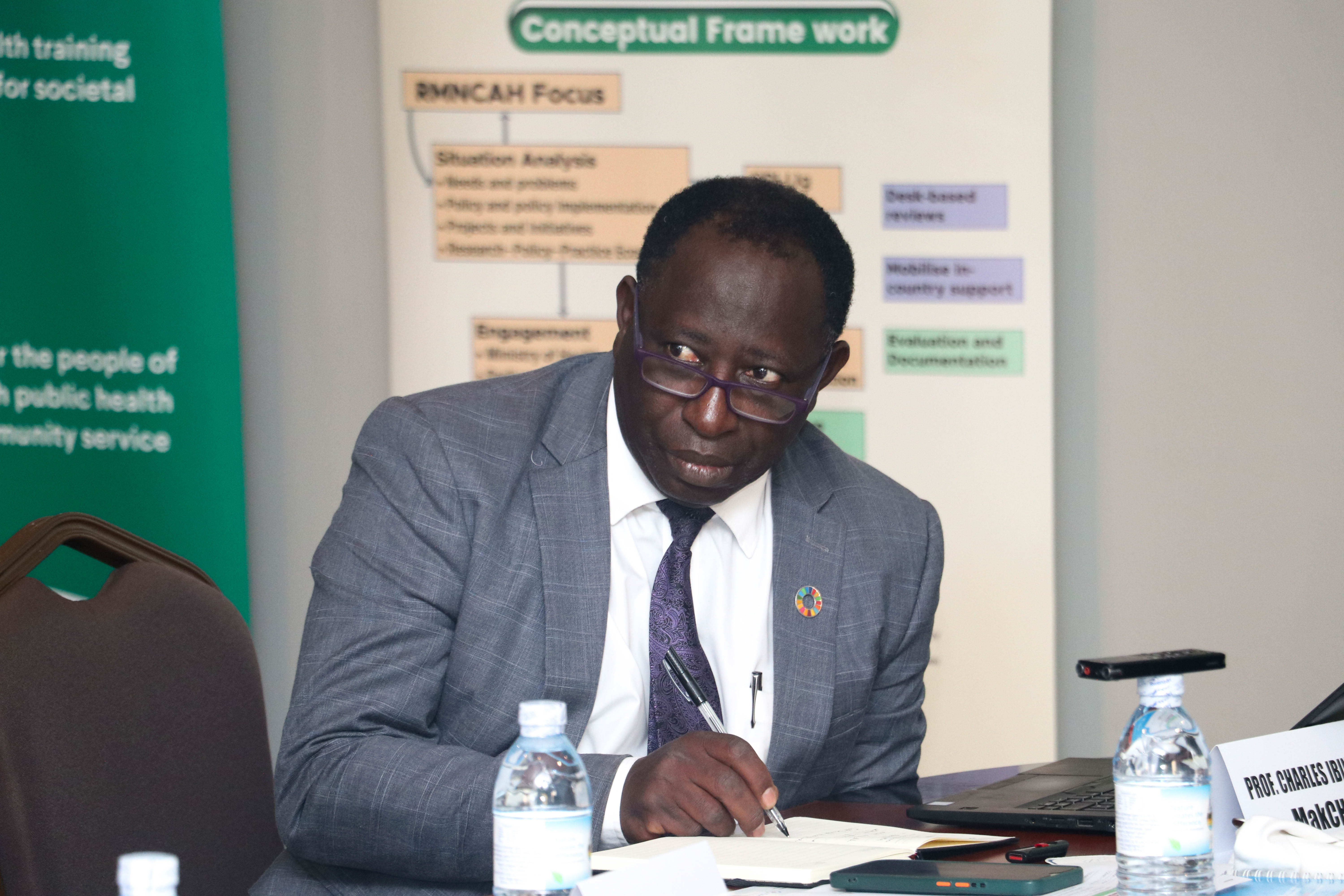 Prof. Charles Ibingira, the team lead on the project takes notes during the RMNCAH partners engagement