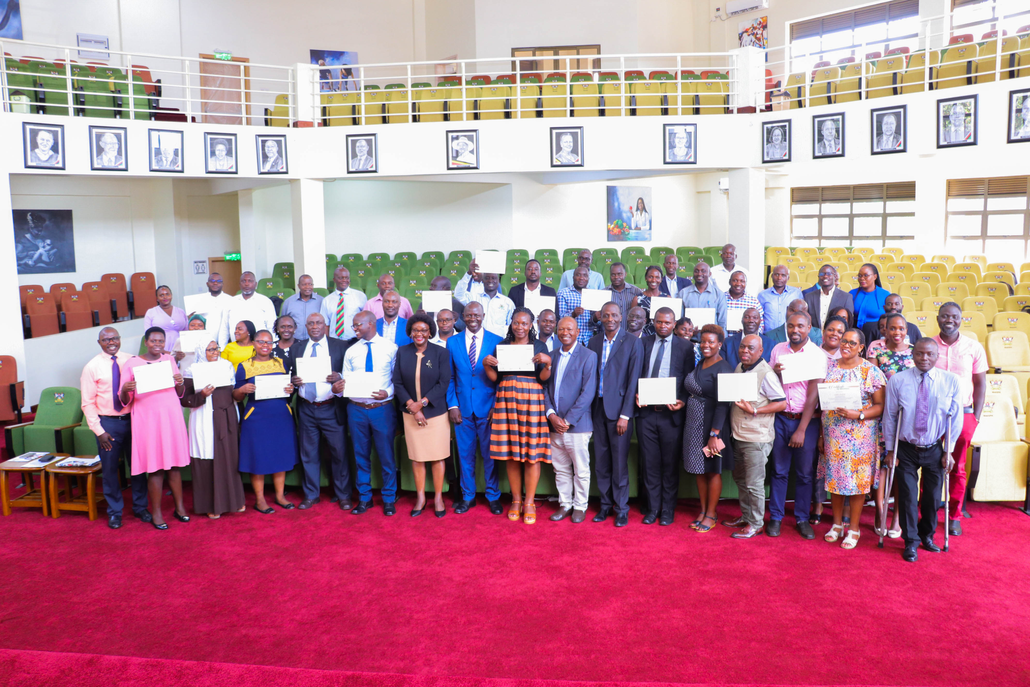 Participants in a group photo shortly after the training with the Commissioner M&E in the OPM, Mr. Timothy Lubanga, IEED project co-leads Dr. Saint Omala and Prof Rhoda Wanyenze and facilitators; Ms. Immaculate Namukasa, Ms. Mary Mbuliro, Dr. Annette Adong, Dr. John Bosco Asiimwe, Dr. Joseph Kagaayi, Prof. Frederick Makumbi, Dr. Aggrey Mukose and Mr. Edson Mwebesa
