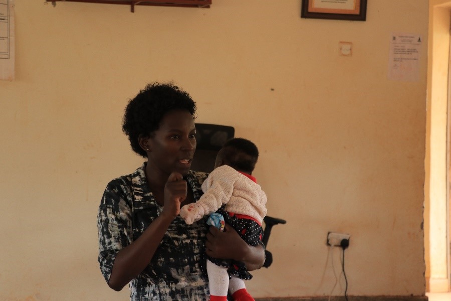 Ms. Doreen Nabwire, the in-charge of Kasanje Health Centre III talking to the participants during the workshop.