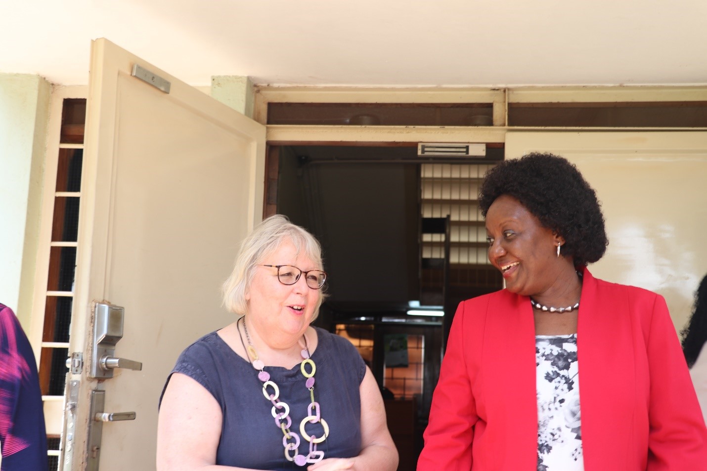 Dr. Linda Gibson of NTU (left) speaking with the Dean of MakSPH, Prof. Rhoda Wanyenze