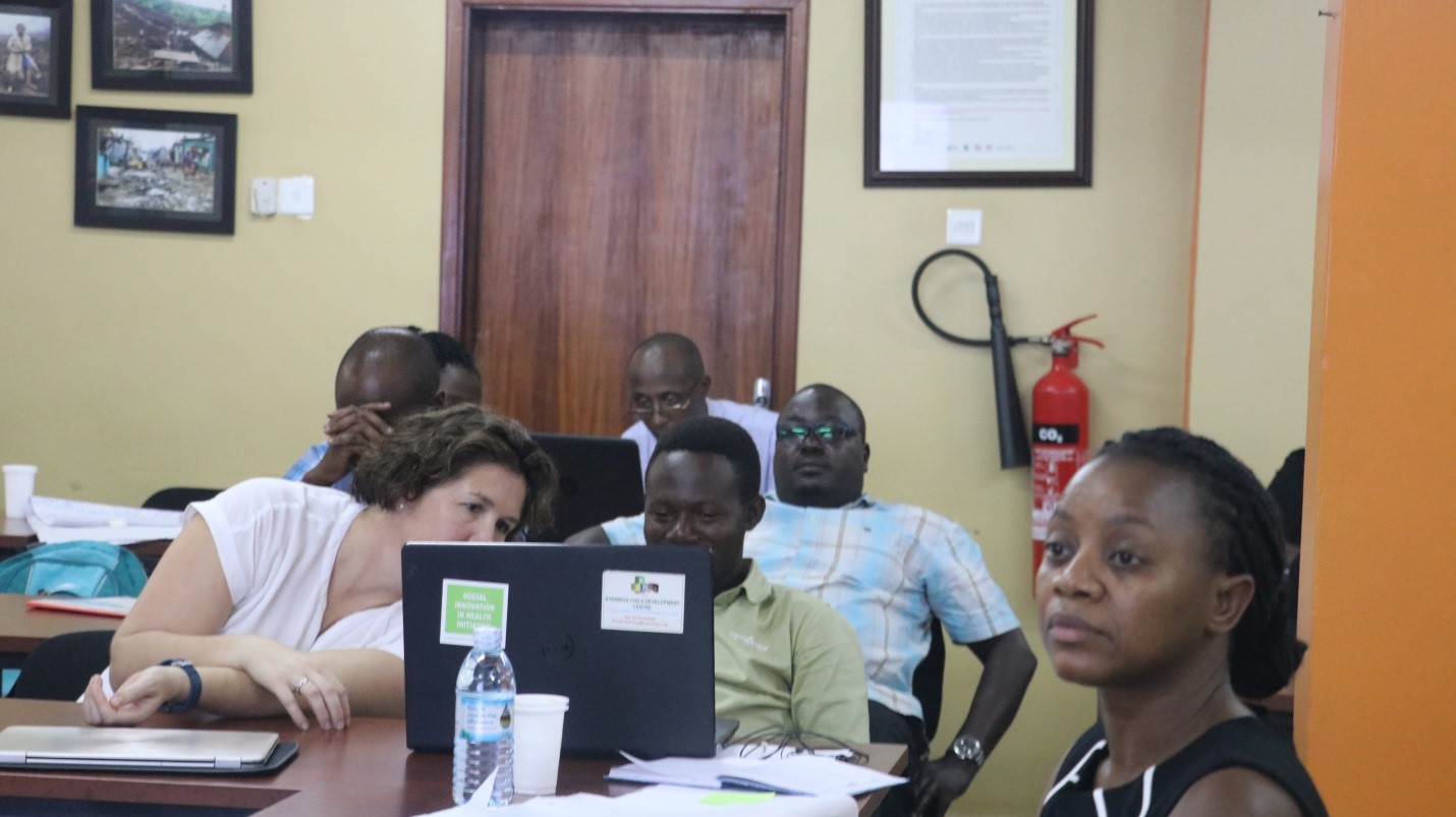 Some of the participants busy with an assignment. Extreme Left is Dr. Phyllis Awor, the Project Lead of SIHI