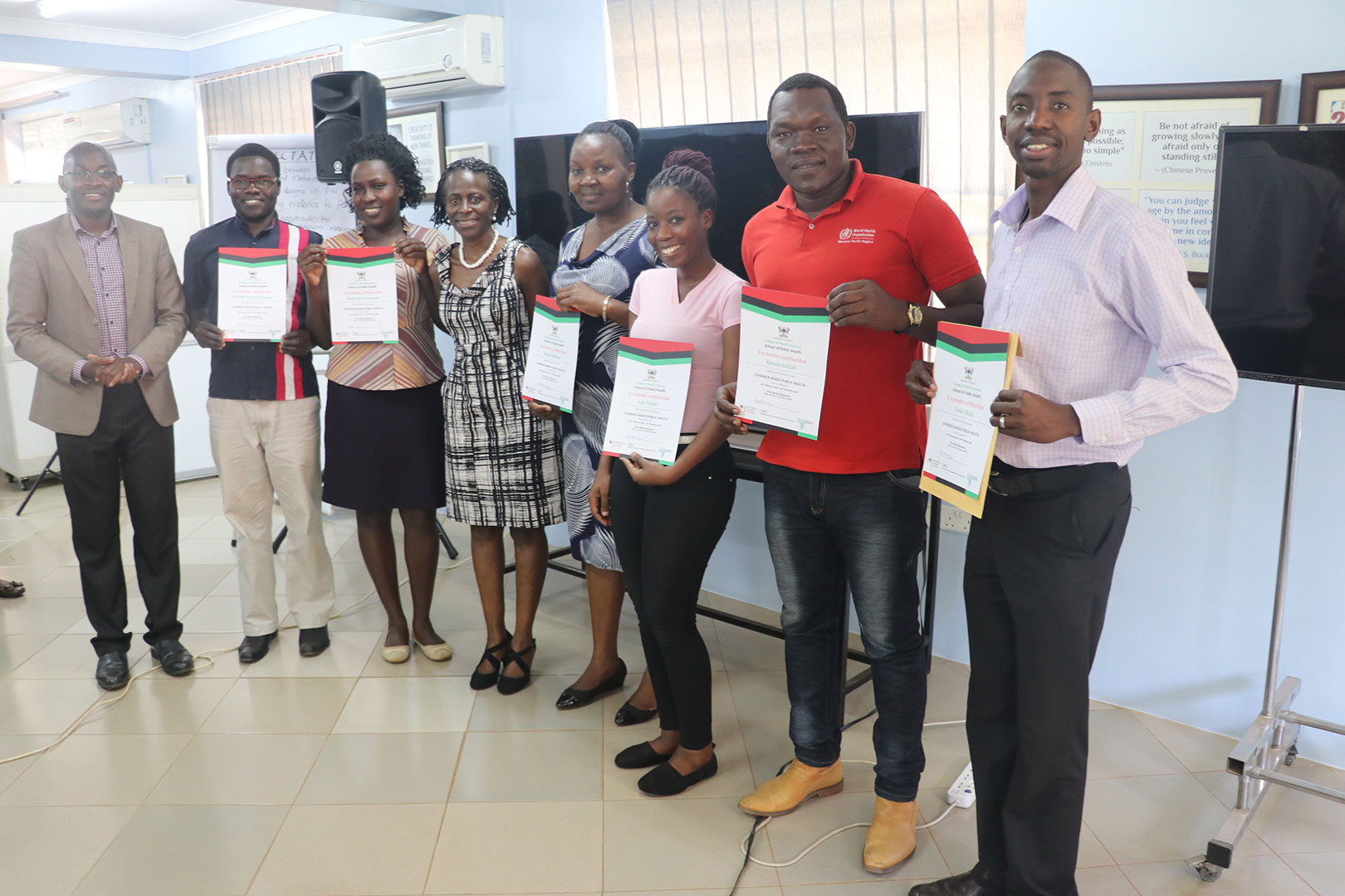 Some of the participants pose for a group photo after receiving their certificates