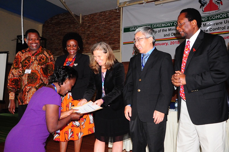Susan Nakubulwa receives her certificate from CDC Director Dr. Lisa Nelson""