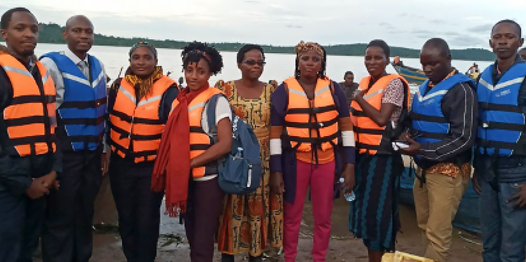 The field team before travelling by boat to the islands - left to right: Filimin Niyongabo, Dr. David Musoke, Grace Biyinzika Lubega, and Joviah Gonza (MakSPH); Christine Wanyana, Aidah Nakate, and Doreen Nabwire (health practitioners / trainers); and Henry Bugembe and Henry Kajubi (field mobilisers).