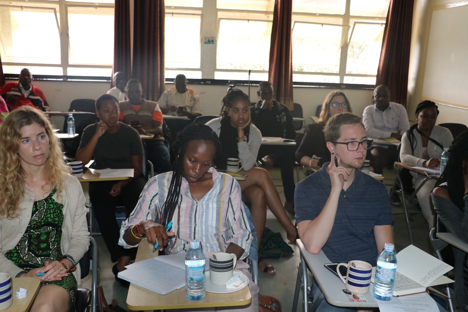 Participants at the symposium listening attentively to the presentations. Participants included students from Makerere University School of Public Health, Georgia State University in the US, Ministry of Health and academicians.
